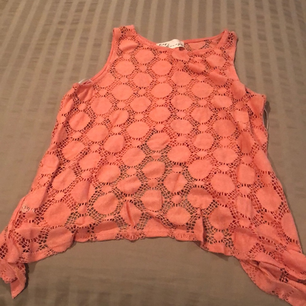 Coral open back asymmetrical bottom tank top with button detail on back